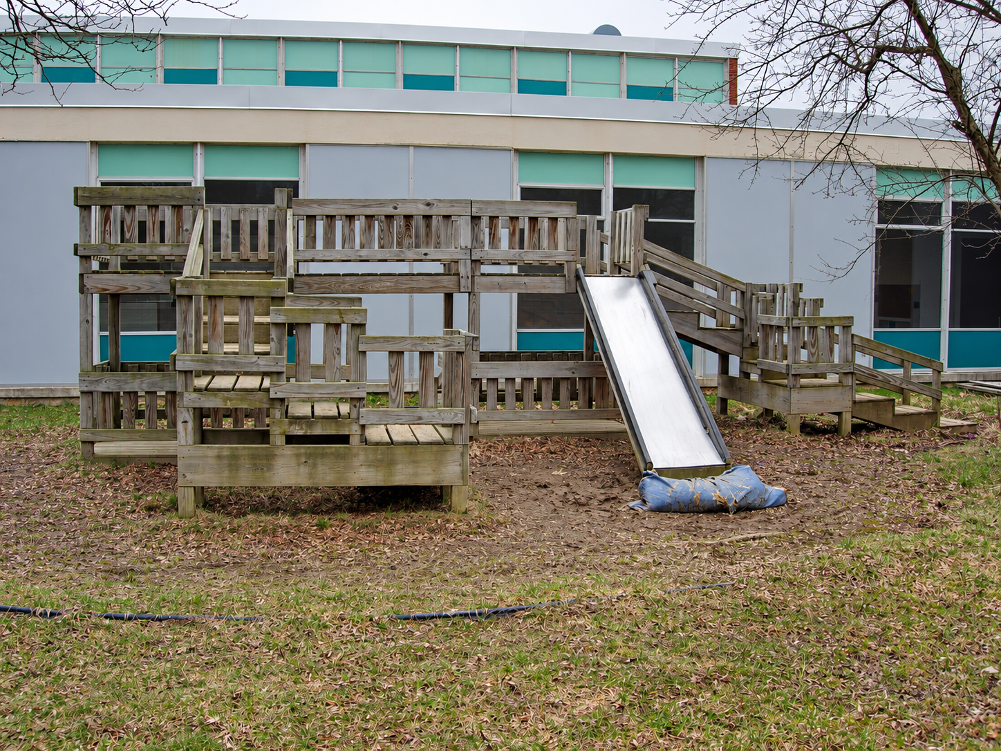 Old wooden playground at Crossroads Center for Children before replacement